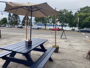 Part of the outside sitting area (four tables here and two out front)  at Custard King  in Astoria