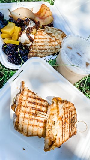 Reuben, cheese plate, and iced tulsi chai at Dobra Tea in Asheville
