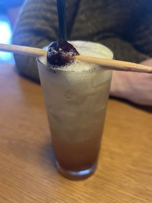 A Buffy the Vampire slayer cocktail with a stake through a cherryy  at East Glisan Pizza Lounge in Portland