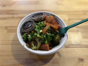 Korean Bowl- organic teriyaki tofu, organic sriracha maple carrots, organic roasted broccoli, local kimchi, homemade teriyaki sauce, green onion, sesame seeds, non-gmo white rice  at Homespun Kitchen - Previously Happy Cup in Atlantic Beach