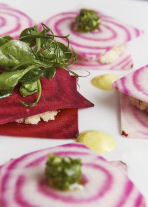 Ruby beetroot sheets with cashew cheese, pea shoots and watercress pesto & yellow pepper coulis.  Photo by Patricia Niven. at Redemption - Chepstow in West London