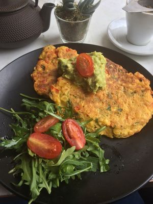 Sweet corn and red pepper savoury pancakes topped with guacamole.  at Redemption - Chepstow in West London