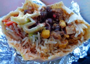 Inside of the vegan burrito: rice, black beans, salsa, TVP chunks marinated in veggies such as corn. Guacamole was extra.  at Effin Burritos in Geneva