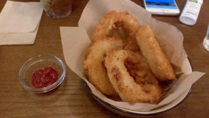 Onion rings with a tiny amount of ketchup.  at Veganic To Go in Tokyo