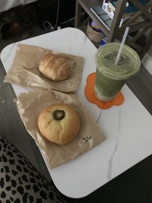 iced matcha latte with hemp milk, jalapeno sausage and chz kolache and breakfast croissant 💕💕  at Fat Cats in Austin