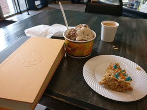 Reading while enjoying ice cream, coffee and a rice crispy treat. All vegan! at Fat Cats in Austin