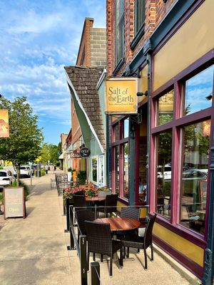 Salt of the Earth - sign and patio seating  at Salt of the Earth in Fennville