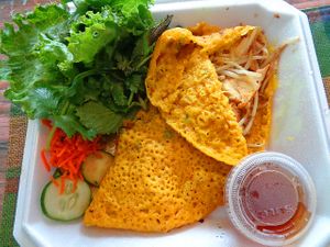 Tofu Crepe. Bánh Xèo (Vietnamese Crêpes) are made with rice flour and turmeric gives them their color. Greens are fresh lettuce, cilantro, mint. My favorite item there by far! at Bowl of Pho in Woodmere
