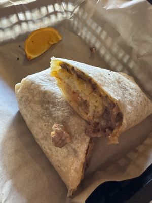 Steak and potato burrito (and a piece of a very bruised orange)  at The Nile in Mesa
