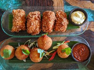 Coconut-crusted fish and sweet potato & corn balls at Atman Kafe in Ubud