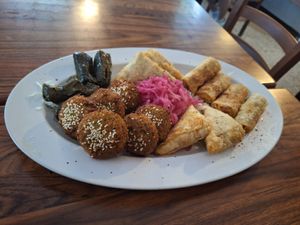 Falafel, vine leaf rolls, potato samosa and fried cabbage rolls at Mr Falafel in Maribor