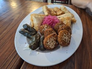 Falafel, vine leaf rolls, potato samosa and fried cabbage rolls at Mr Falafel in Maribor