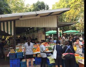 fruit and some prepared hot sit-down vegan food at Lumpini Park Morning Market Stall in Bangkok