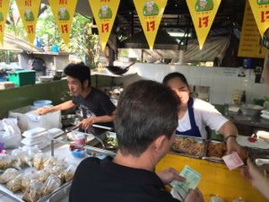 look for Yellow Flags with what looks like 17 at Lumpini Park Morning Market Stall in Bangkok