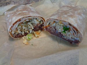 Vegan Burrito in deli aisle. Whole wheat wrap, refried black beans, brown rice, salsa with scallions and cilantro. at Mustard Seed Market - Highland Sqaure in Akron