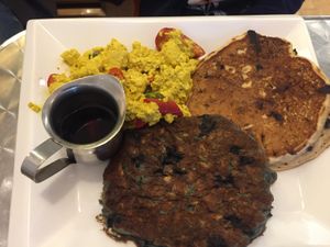 Kid’s plate - “You pick 3” - this is the tofu scramble, a blueberry oatmeal pancake and a banana chocolate chip pancake  at Cosmic Treats in Toronto