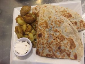 Special of the week - Quesadilla with cheese, beans, veggies and added chick’n at Cosmic Treats in Toronto