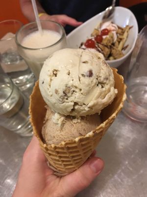 Large waffle cone with butter pecan & cinnamon ice cream scoops at Cosmic Treats in Toronto