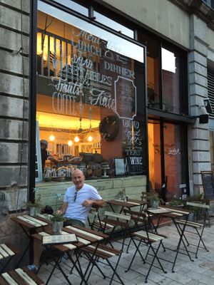 Some of the outdoor seating is in front of the restaurant. Additional outdoor seating is across the narrow street. at CsendesM Vegan Bistro in Budapest