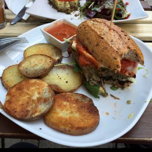 Vegan Cheeseburger with fried potatoes and homemade ketchup  at CsendesM Vegan Bistro in Budapest