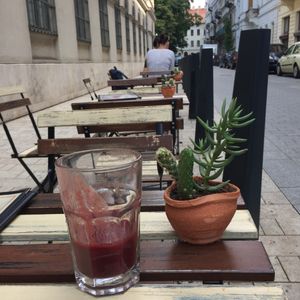 Tables on the other side of the street. Very cute! at CsendesM Vegan Bistro in Budapest