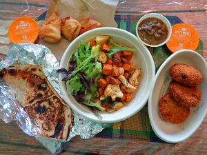 Perfect Balance Bowl (chose greens, chickpea masala, and veg croquettes) with sides of  Samosas and Wheat Naan. at Choolaah in Beachwood