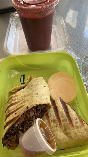 Black bean wrap, Vegan, Gluten Free and Soy Free. With a mango, blueberry and banana smoothie .  at Eden's Vegan Juice Bar Cafe in Palm Coast
