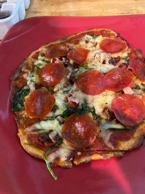 Our Eden Gluten-free pizza 10” it’s personal… at Eden's Vegan Juice Bar Cafe in Palm Coast