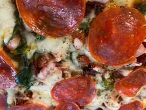 Ooooo real hand made everything personal 10” pizza. Everything is VEGAN….14.99 add any other ingredients or toppings  at Eden's Vegan Juice Bar Cafe in Palm Coast