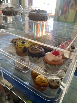 Multiple gluten-free vegan cupcakes to choose from. Chocolate fudge, lemon blueberry, scones.  at Eden's Vegan Juice Bar Cafe in Palm Coast