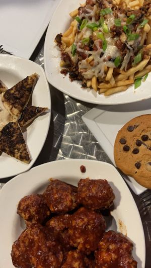 Bbq cauliflower wings, pita and hummus, chili fries and a cookie!! at Lovin' Spoonfuls in Tucson