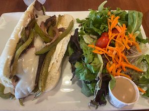 Vegan Philly cheesesteak with mixed greens and vegan house dressing   at Lovin' Spoonfuls in Tucson