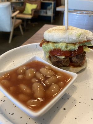 Vegan muffin with sausage and guacamole. Additional baked beans  at Theera in Bangkok