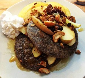 Vegan pancakes with apple crumble topping at Theera in Bangkok