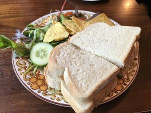 Fish less finger and tomato ketchup sandwich on white bread  at The Little Potting Shed Cafe in Oban