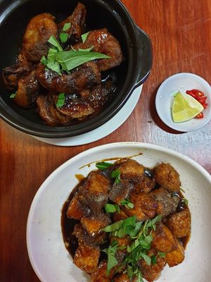 Fish claypot (top) and braised chickn and tofu at Bo De Trai in Footscray