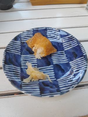 Half eaten inarisushi onigiri at Matcha Komachi in Vienna