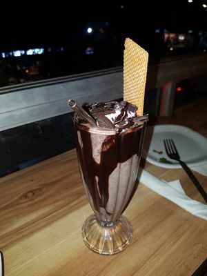 Huge oreo chocolate shake. Much more than I expected, real cookies mashed inside, lots of chocolate and whipped "cream" on top. Just wow 10/10 at The Real Green Cafe in Pune