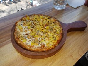 Hawaiian BBQ pizza (small). Great toppings, lots of cheese and special sauce. Amazing 9/10 at The Real Green Cafe in Pune