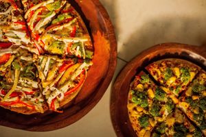 Tofu Love Pizza and Broccoli Corn Pizza at The Real Green Cafe in Pune