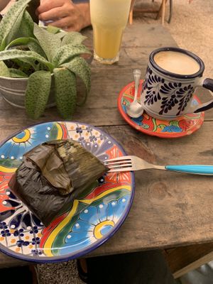 Tamale, latte and juice  at Suculenta in Tulum