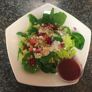 Endless Summer Salad. Vegetarian.
Organic romaine and baby spinach, strawberries, red onions, goat cheese, pine nuts, homemade raspberry vinaigrette. Gluten Free.  at Green Zebra Cafe in Sarasota