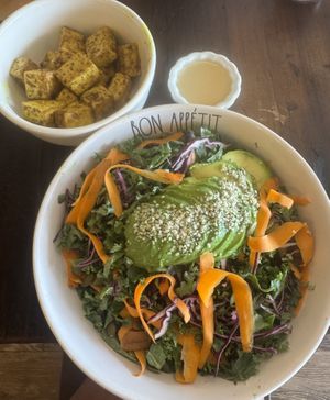 The Rainbow Kale Salad with grilled tofu and house made lemon vinaigrette in the side.   at Green Zebra Cafe in Sarasota