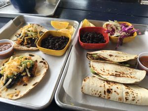 Sunday brunch: potato & bean tacos (left). Jackfruit barbacoa tacos w/ coleslaw  at La Botanica in San Antonio
