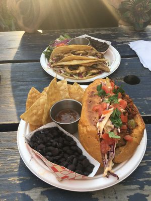 Chayote y chorizo torta and oyster mushroom tacos. All delicious and he tortillas and bread were super fresh.  at La Botanica in San Antonio
