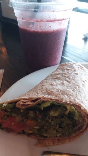 Black bean patty wrap and apple berry smoothie at Fit & Fuel Bicycle Cafe in Naples