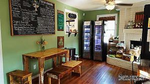 Natural Living's added some very cool seating for their vegan cafe with a mini farm table made from pallet wood, so unique and charming.  Their new menu board is offers much more than the previous juice bar did.   at Natural Living Food Co-op and Cafe in League City