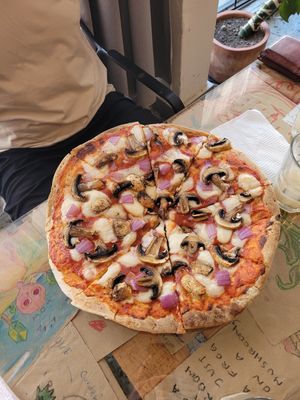 Pizza with mushrooms and onions at La Ruta Vegana in Mazatlan