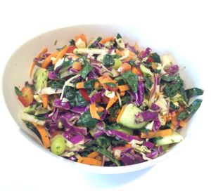 Veggie Chop Salad - Hearty blend of cabbage, kale, cucumber, carrots, red pepper, and edamame tossed in a Thai peanut, lime, and cilantro dressing. at Oki Momo in San Luis Obispo