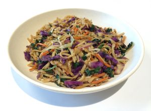 Fair-trade, organic brown rice noodles seared on our flatiron grill with kale, cabbage, and carrot ribbons. at Oki Momo in San Luis Obispo